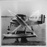 A side view of a U.S. Navy F6C-3 fighter aircraft in its seaplane variant.